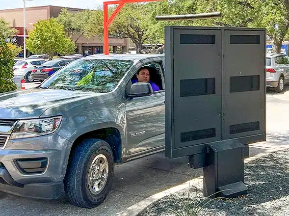 customer looking at drive thru menu