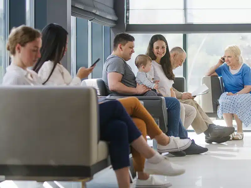 family and patients in waiting room